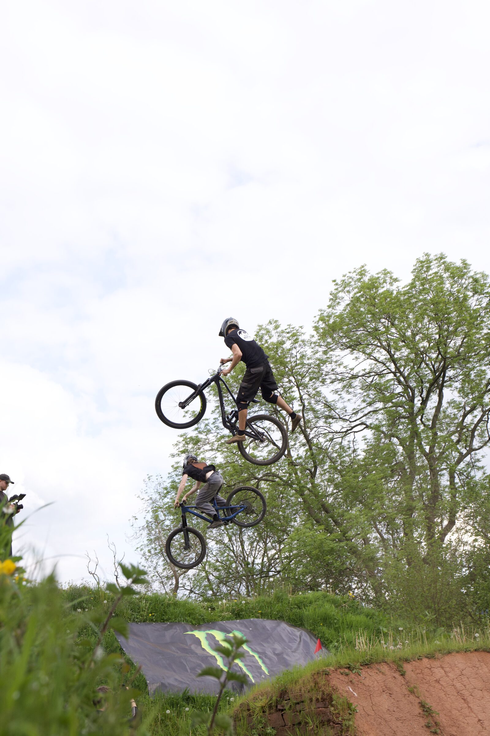Cyclist descending through trees